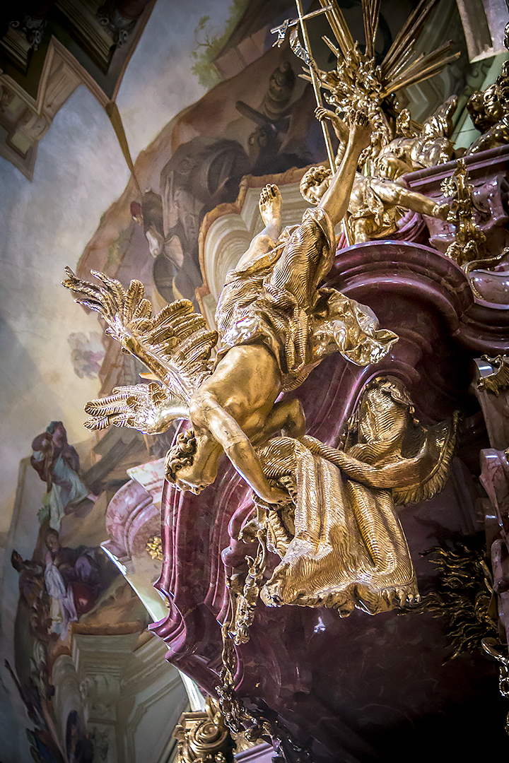 A pulpit sculpture in St. Nicholas Church, Prague